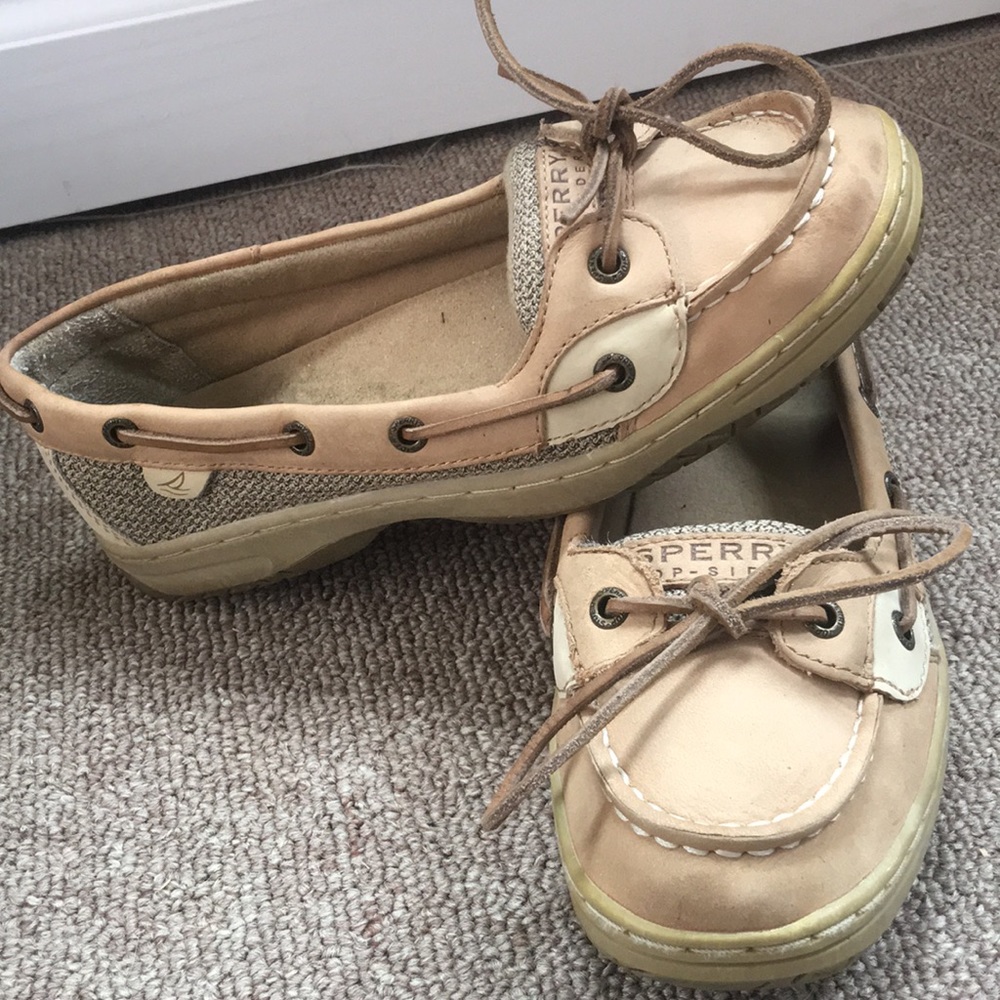 Light tan Sperry boat shoes.